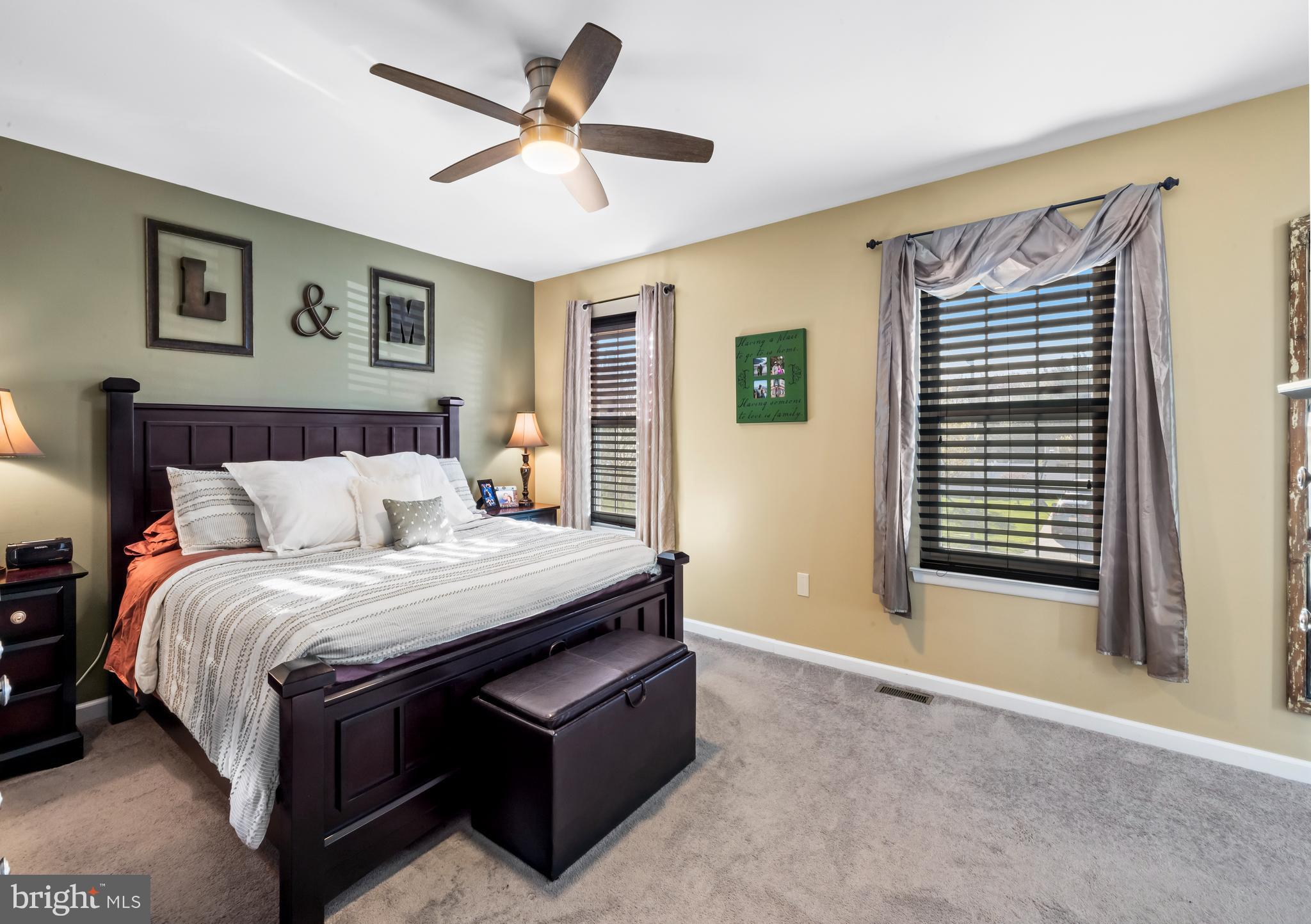 34 Borrelly Boulevard Sewell, NJ 08080 - Photo 15 of 23 a spacious bedroom with a bed and a chandelier