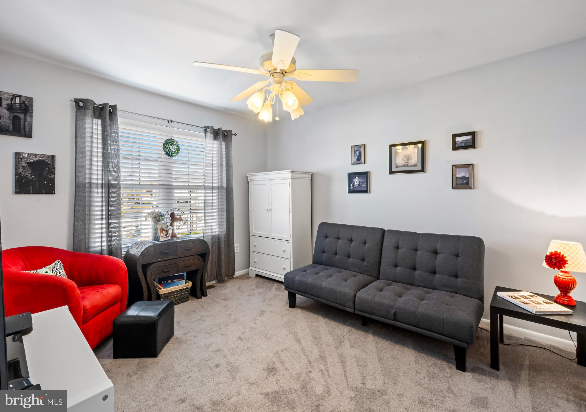34 Borrelly Boulevard Sewell, NJ 08080 - Photo 19 of 23 a living room with furniture a large window and a chandelier