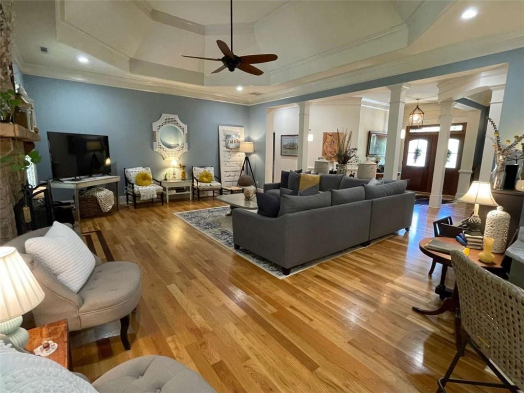 1531 Overlook Pass Road Monroe, GA 30655 - Photo 13 of 78 a living room with furniture a flat screen tv and a large window