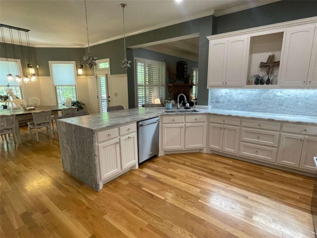 1531 Overlook Pass Road Monroe, GA 30655 - Photo 17 of 78 a large white kitchen with kitchen island a sink stainless steel appliances and cabinets