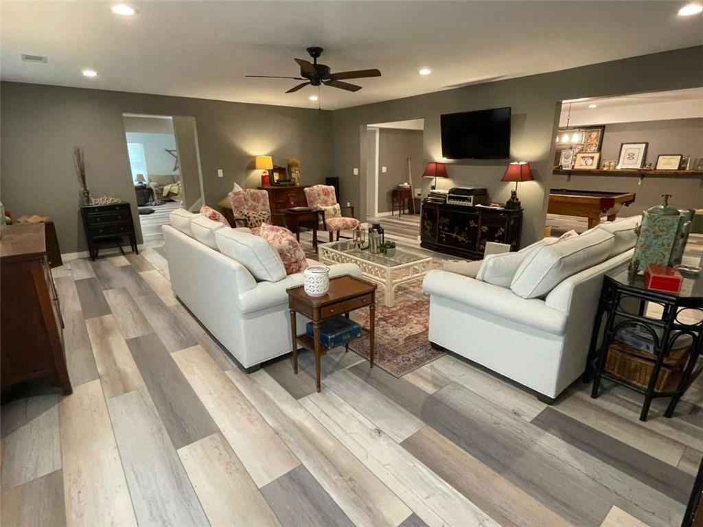 1531 Overlook Pass Road Monroe, GA 30655 - Photo 20 of 78 a living room with furniture a flat screen tv and a fireplace