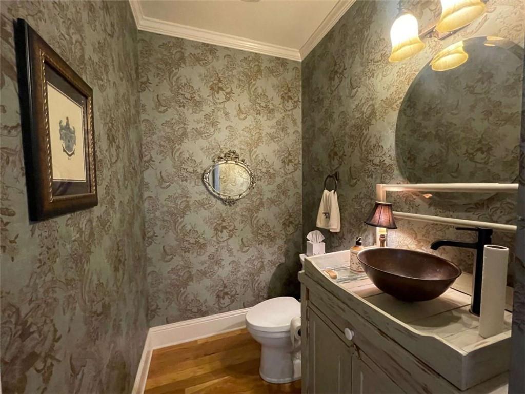 1531 Overlook Pass Road Monroe, GA 30655 - Photo 23 of 78 a bathroom with a granite countertop toilet sink and mirror