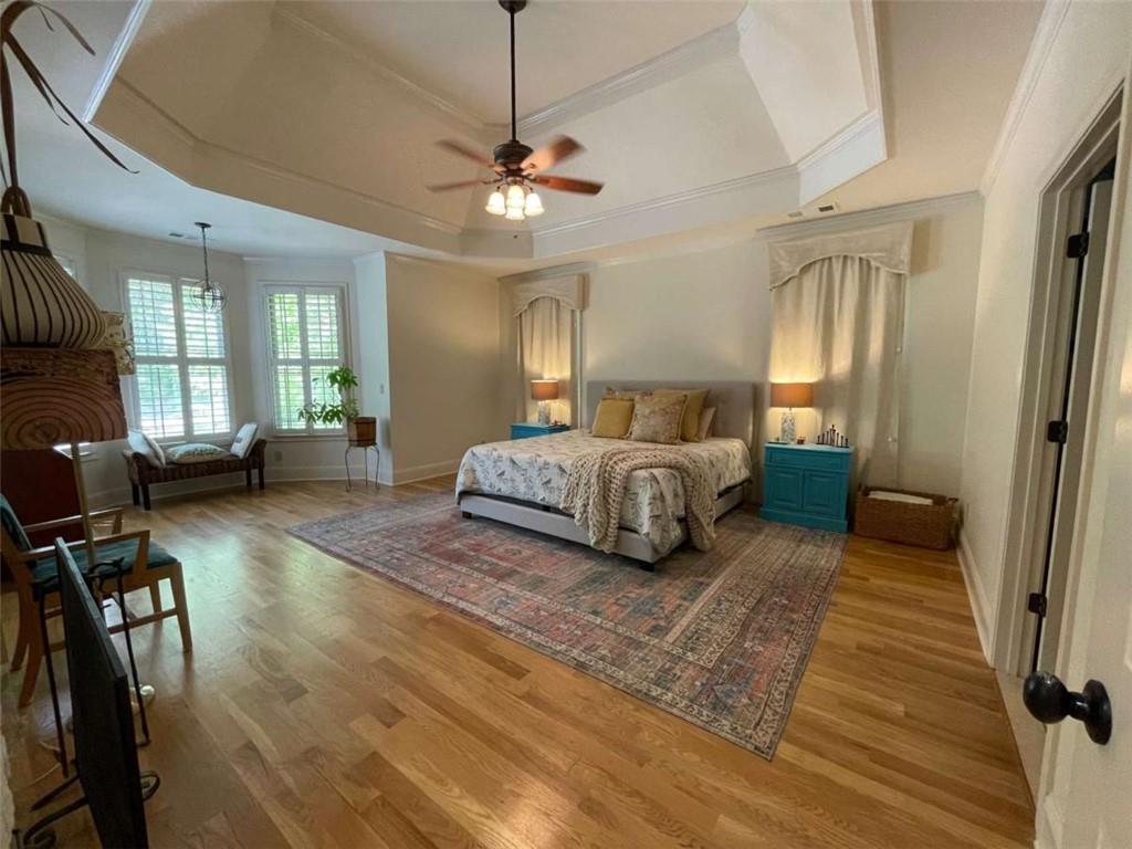 1531 Overlook Pass Road Monroe, GA 30655 - Photo 25 of 78 a living room with a bed furniture and a wooden floor