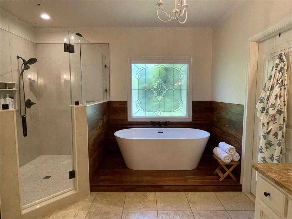 1531 Overlook Pass Road Monroe, GA 30655 - Photo 28 of 78 a bathroom with a bathtub and shower