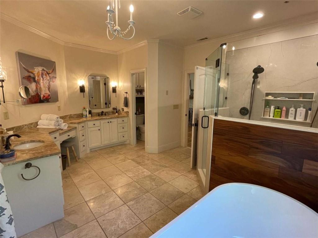 1531 Overlook Pass Road Monroe, GA 30655 - Photo 31 of 78 a bathroom with a sink a mirror and a shower