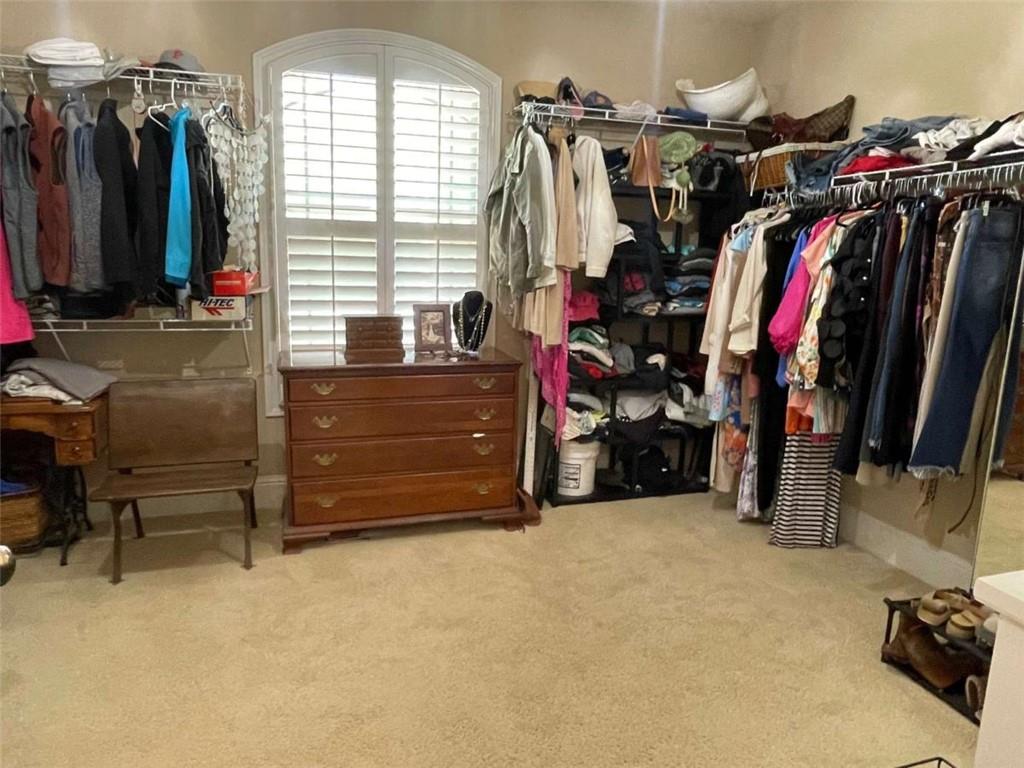 1531 Overlook Pass Road Monroe, GA 30655 - Photo 33 of 78 a view of walk in closet with clothes