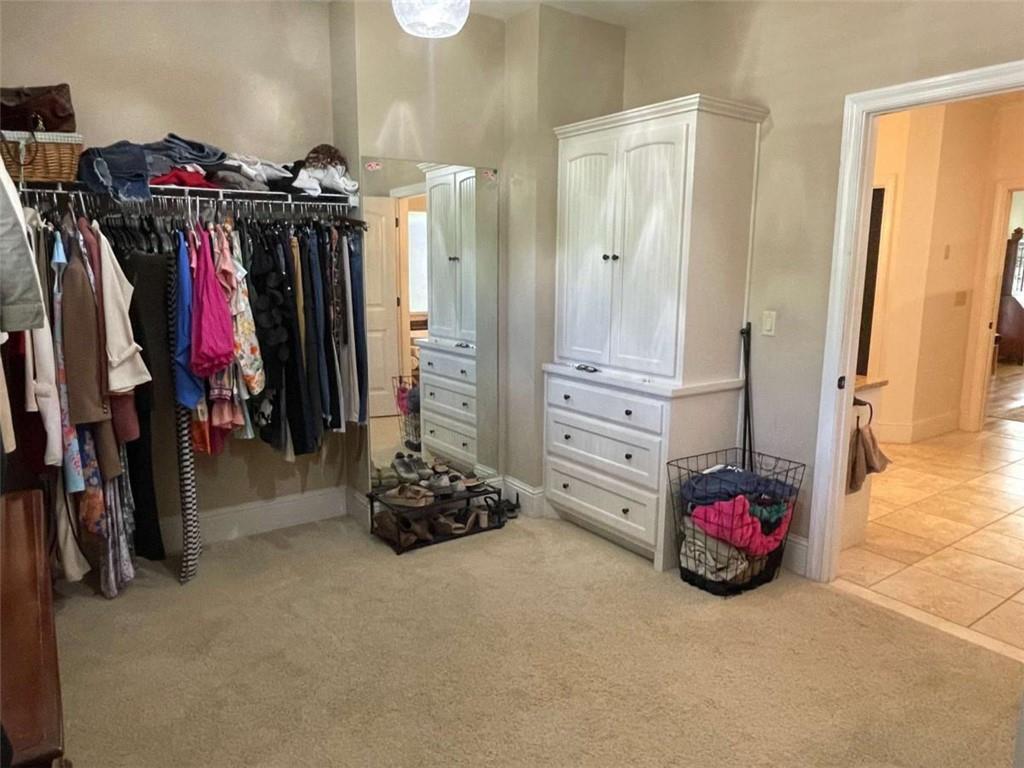 1531 Overlook Pass Road Monroe, GA 30655 - Photo 34 of 78 a view of walk in closet with clothes and shoes