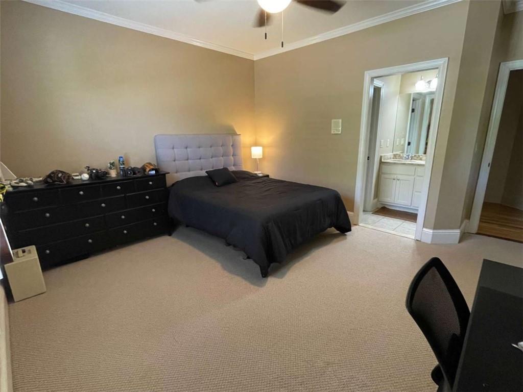 1531 Overlook Pass Road Monroe, GA 30655 - Photo 35 of 78 a bedroom with a bed and a flat tv screen on dresser