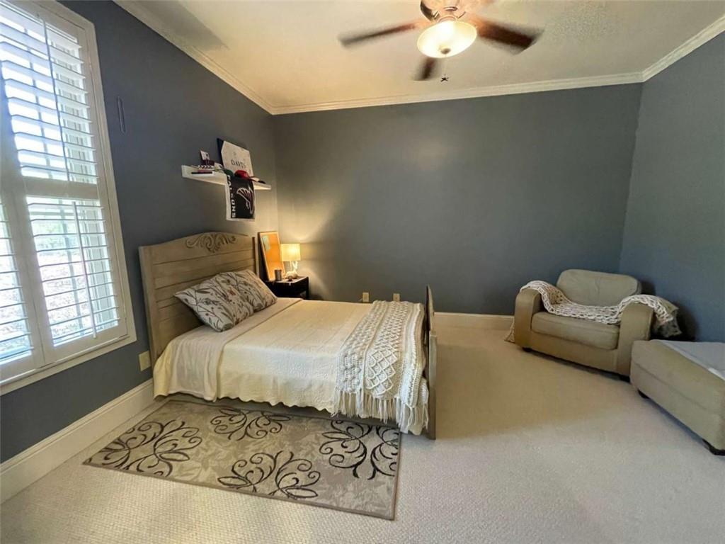 1531 Overlook Pass Road Monroe, GA 30655 - Photo 38 of 78 a bedroom with a bed and couch