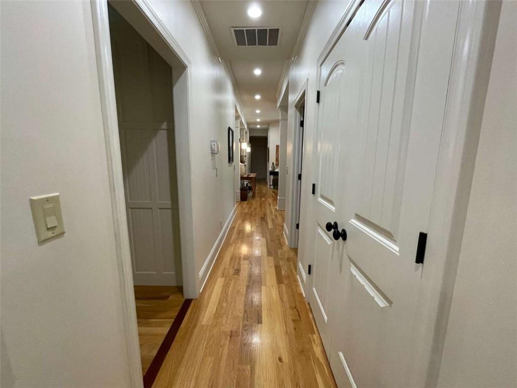 1531 Overlook Pass Road Monroe, GA 30655 - Photo 41 of 78 a view of a hallway with wooden floor and staircase