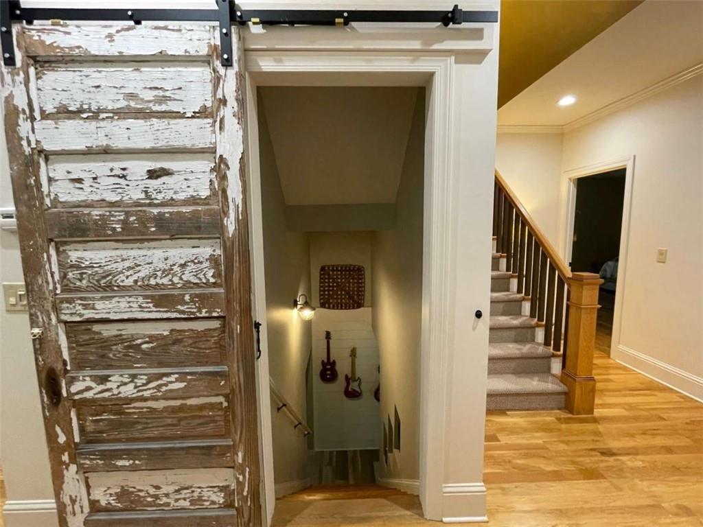 1531 Overlook Pass Road Monroe, GA 30655 - Photo 47 of 78 a view of a hallway with wooden floor and staircase