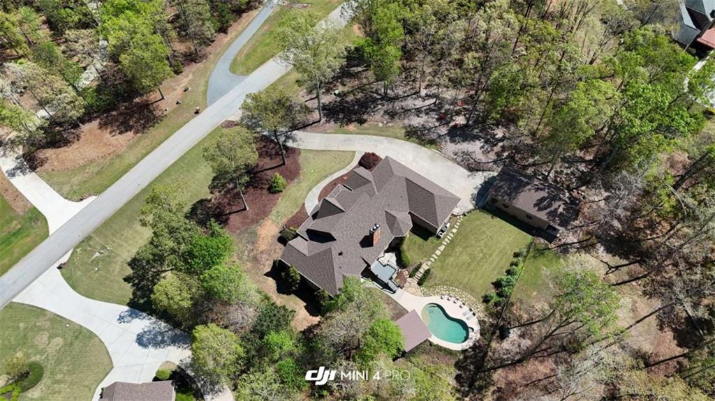 1531 Overlook Pass Road Monroe, GA 30655 - Photo 5 of 78 an aerial view of a house with a yard and greenery