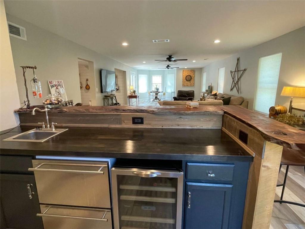 1531 Overlook Pass Road Monroe, GA 30655 - Photo 65 of 78 a kitchen with kitchen island a sink appliances and cabinets