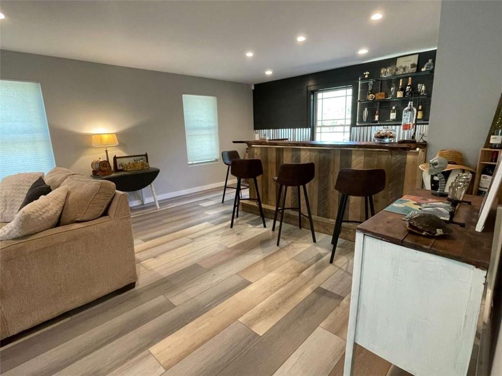1531 Overlook Pass Road Monroe, GA 30655 - Photo 66 of 78 a living room with stainless steel appliances kitchen island granite countertop furniture and a view of kitchen
