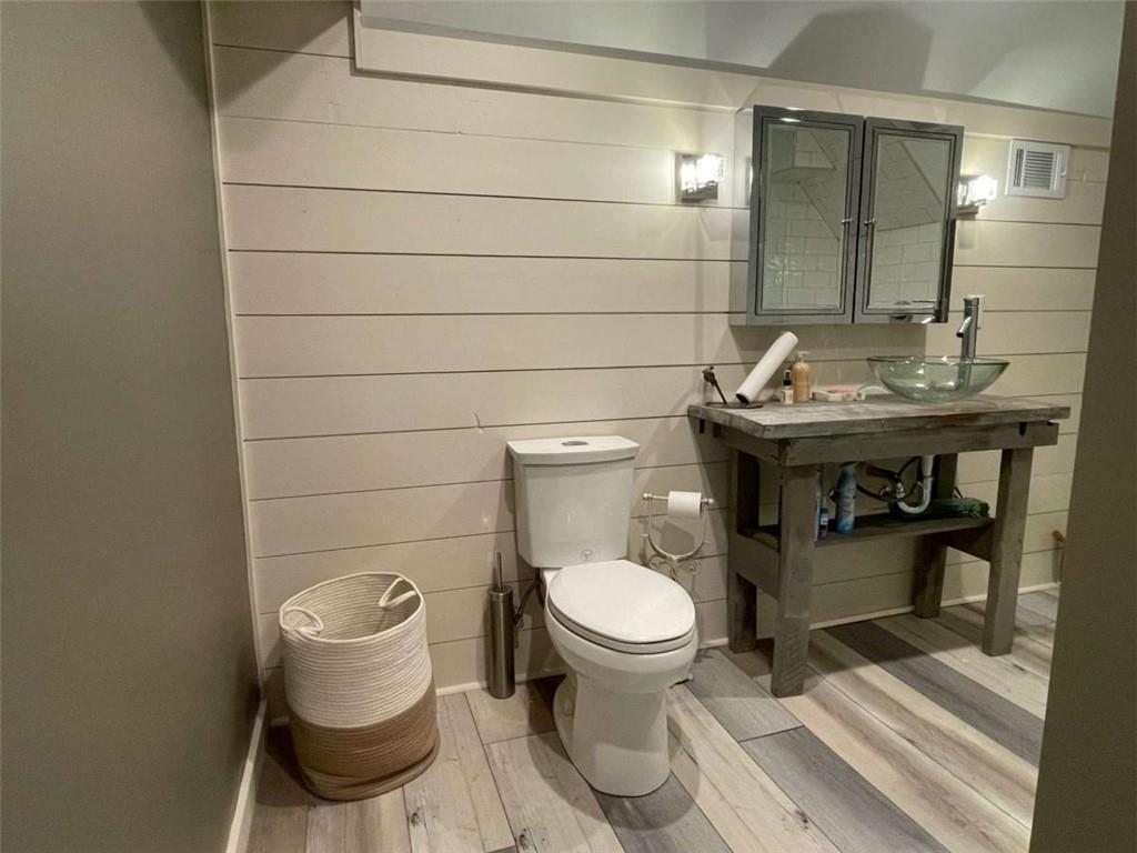 1531 Overlook Pass Road Monroe, GA 30655 - Photo 67 of 78 a bathroom with a sink toilet and a mirror