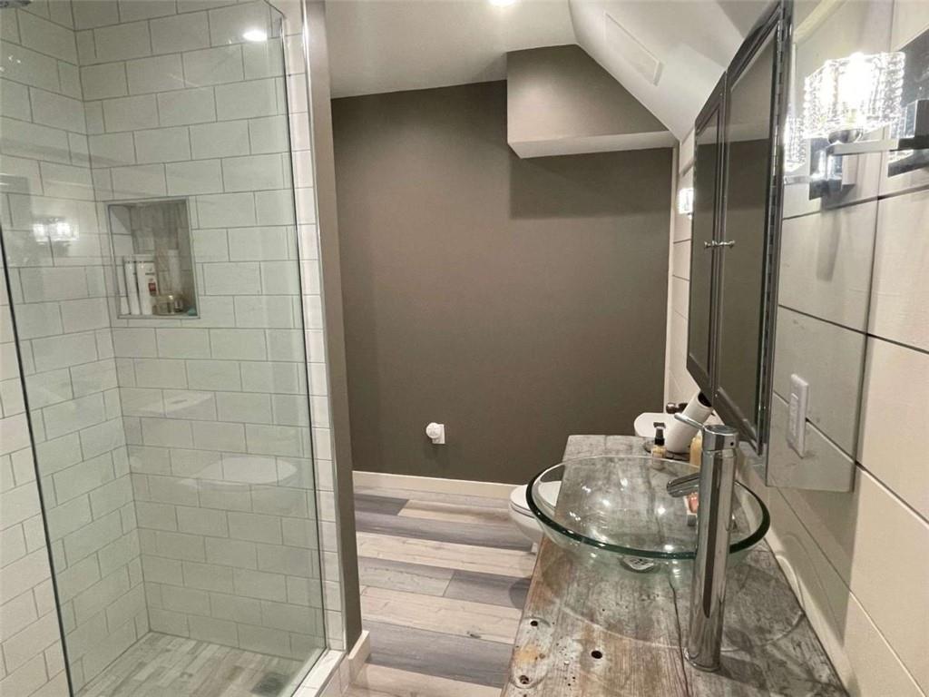 1531 Overlook Pass Road Monroe, GA 30655 - Photo 68 of 78 a bathroom with a sink and mirror