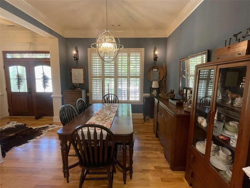 1531 Overlook Pass Road Monroe, GA 30655 - Photo 9 of 78 a view of a dining room with furniture and chandelier