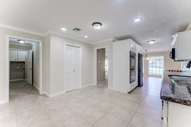 a view of a kitchen with a sink