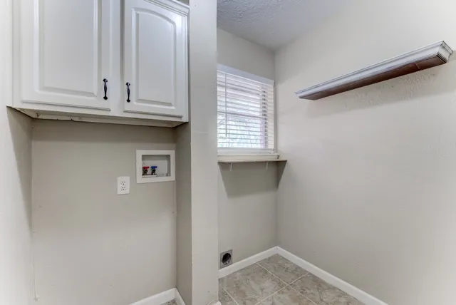a view of cabinets and window