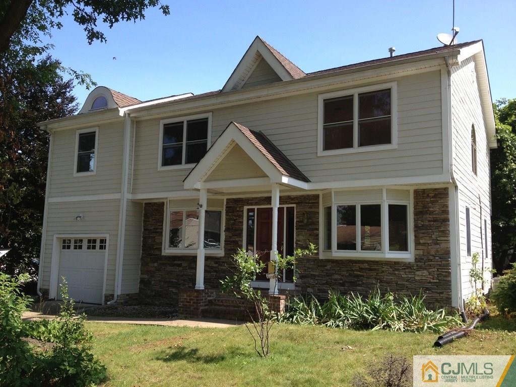 50 Dover Road Colonia, NJ 07067 - Photo 1 of 11 a view of a house with yard and plants