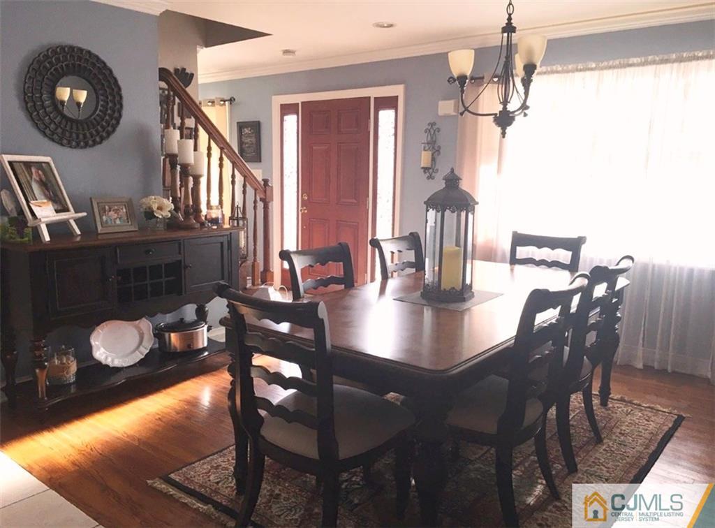 50 Dover Road Colonia, NJ 07067 - Photo 4 of 11 a view of a dining room with furniture and chandelier