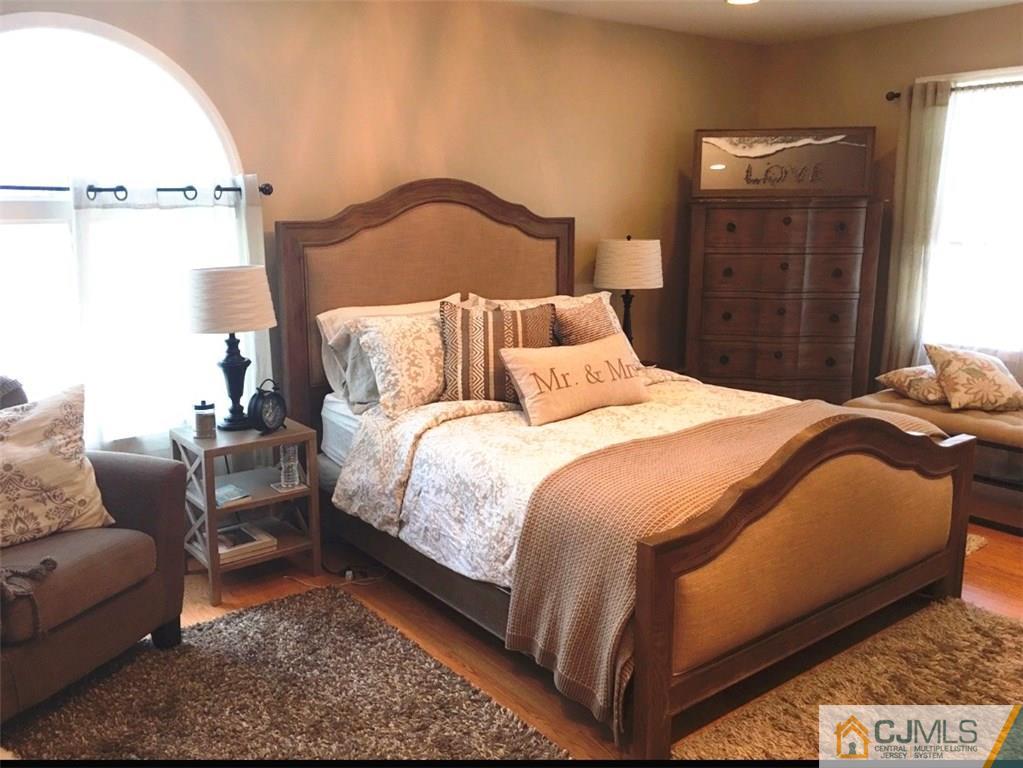 50 Dover Road Colonia, NJ 07067 - Photo 7 of 11 a bedroom with a bed and a couch