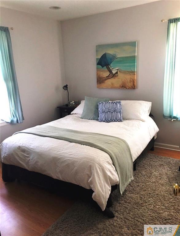 50 Dover Road Colonia, NJ 07067 - Photo 10 of 11 a bedroom with a bed and a painting on the wall