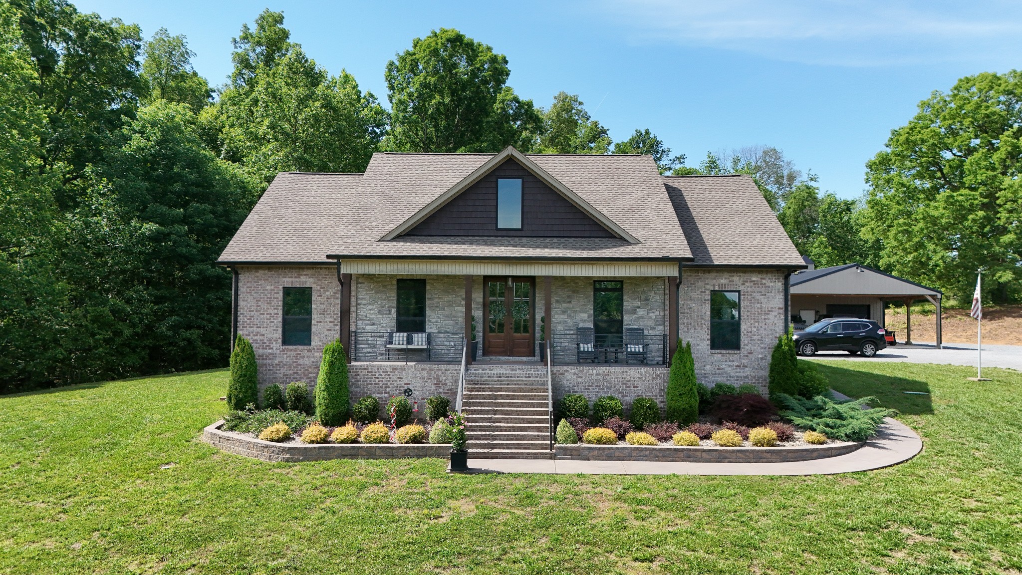 138 Belcher Hollow Road Cottontown, TN 37048 - Photo 1 of 60 a front view of a house with a yard