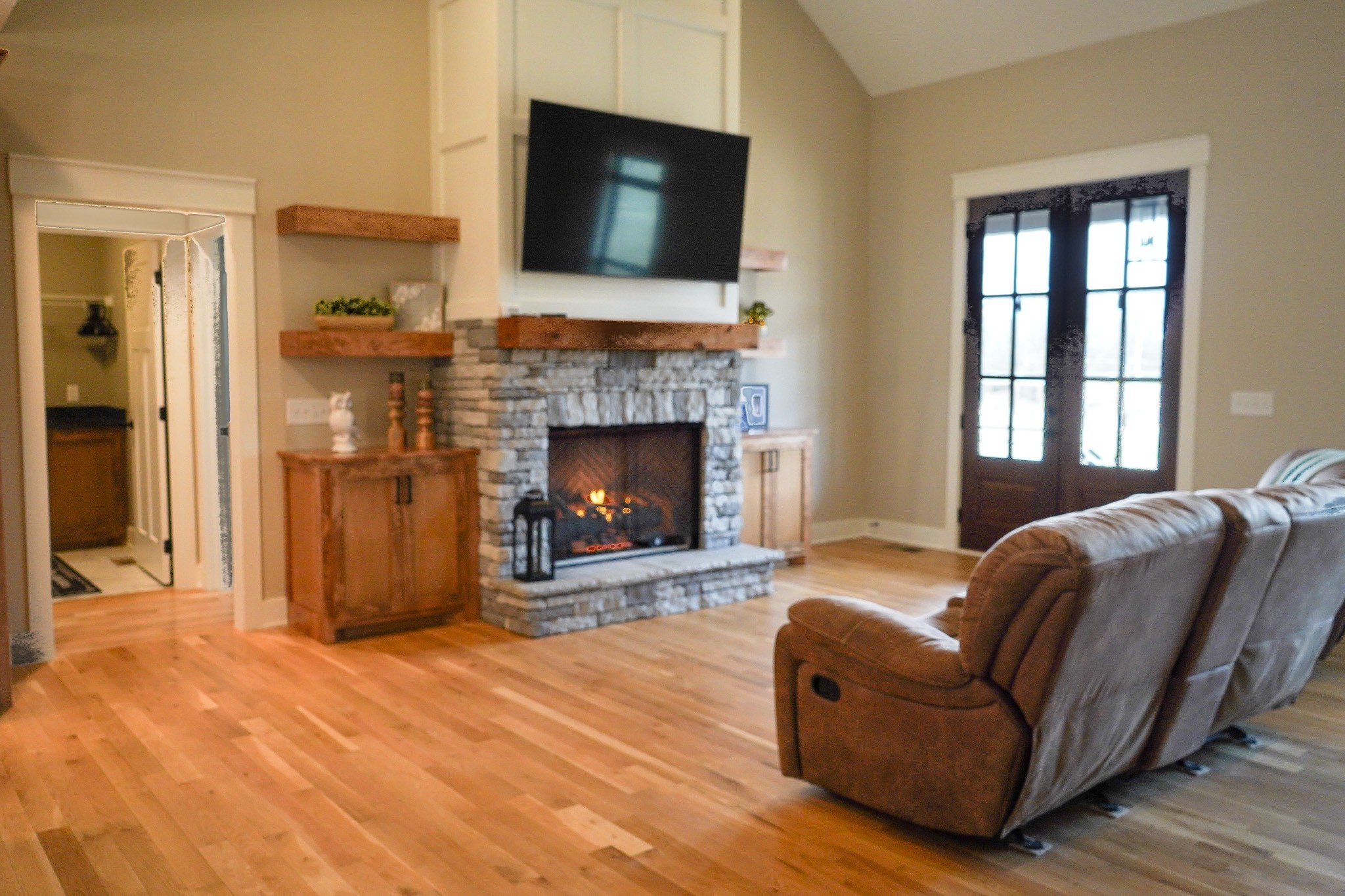 138 Belcher Hollow Road Cottontown, TN 37048 - Photo 27 of 59 a living room with furniture and a fireplace