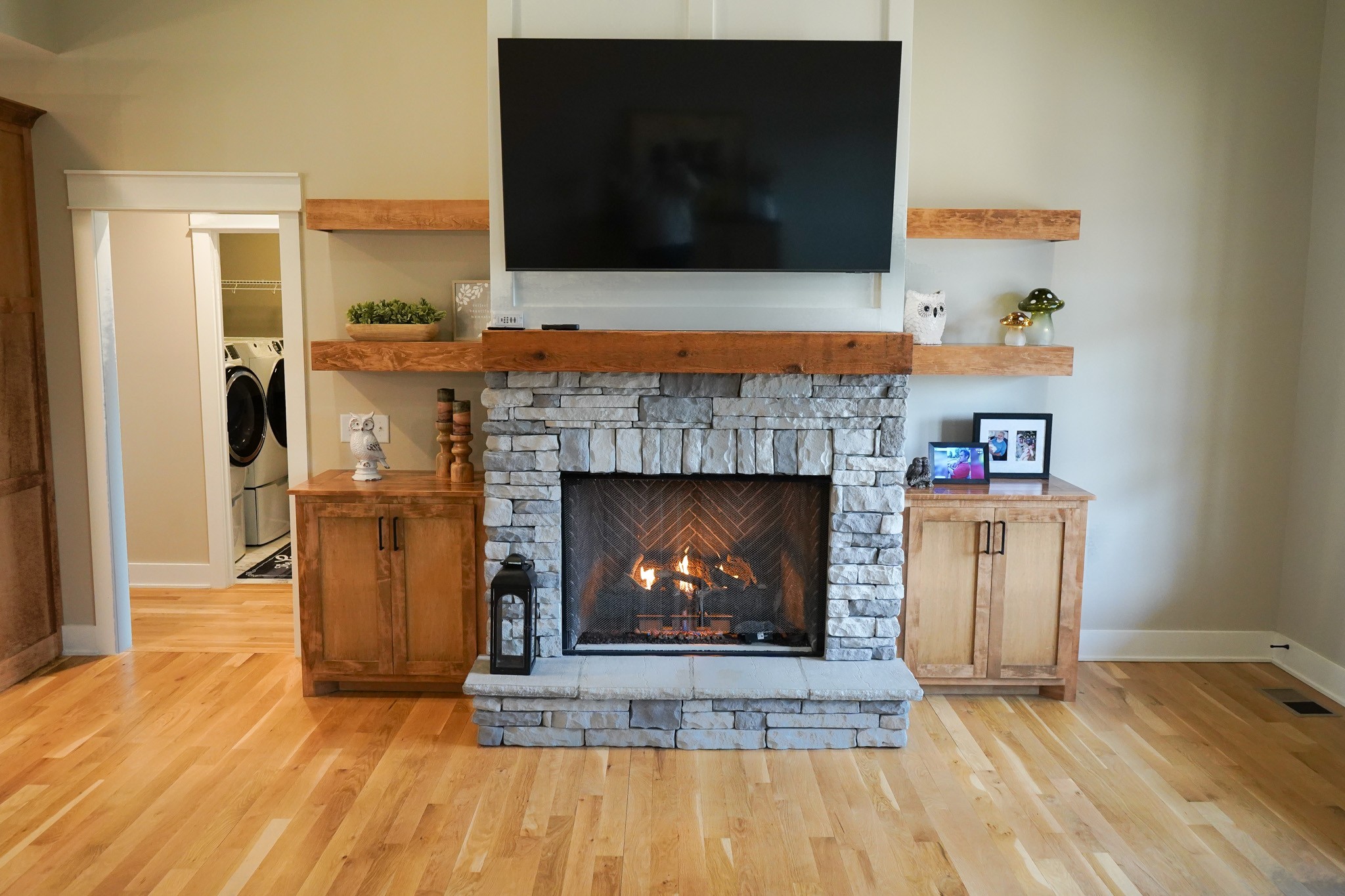 138 Belcher Hollow Road Cottontown, TN 37048 - Photo 29 of 60 a living room with a fireplace a flat screen tv and a fireplace