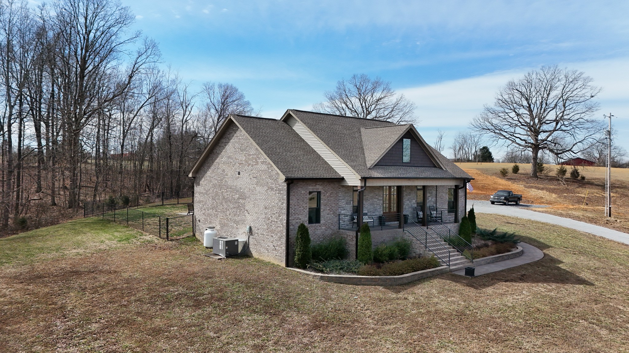 138 Belcher Hollow Road Cottontown, TN 37048 - Photo 3 of 59 a view of a house with a yard