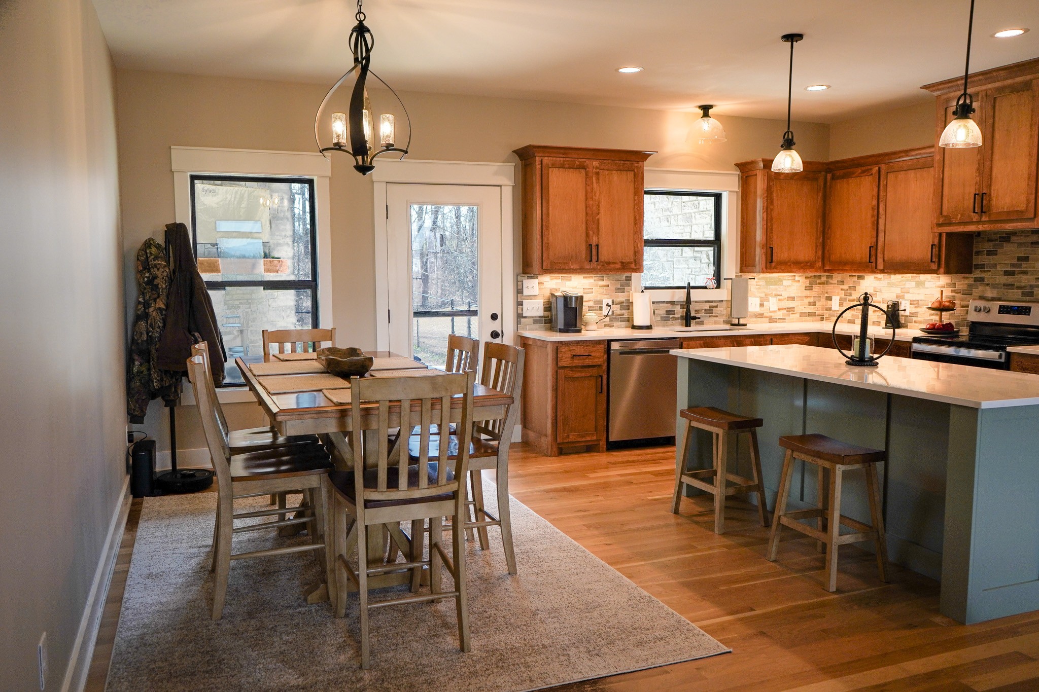 138 Belcher Hollow Road Cottontown, TN 37048 - Photo 33 of 59 a kitchen with a dining table chairs sink and stove