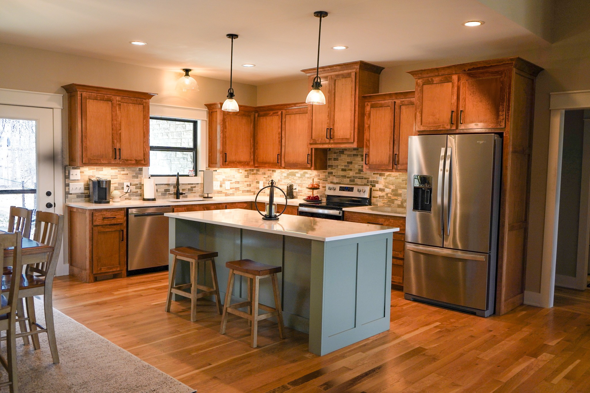 138 Belcher Hollow Road Cottontown, TN 37048 - Photo 35 of 60 a kitchen with stainless steel appliances granite countertop a refrigerator a sink a stove a dining table and chairs