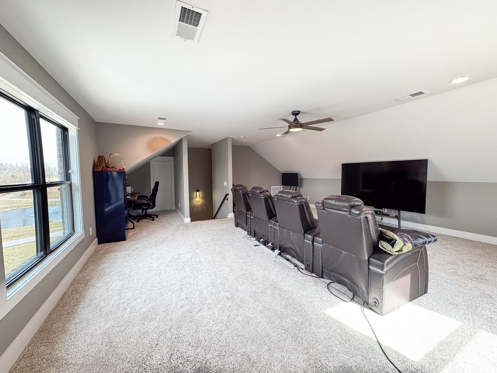 138 Belcher Hollow Road Cottontown, TN 37048 - Photo 42 of 59 a living room with furniture and a flat screen tv