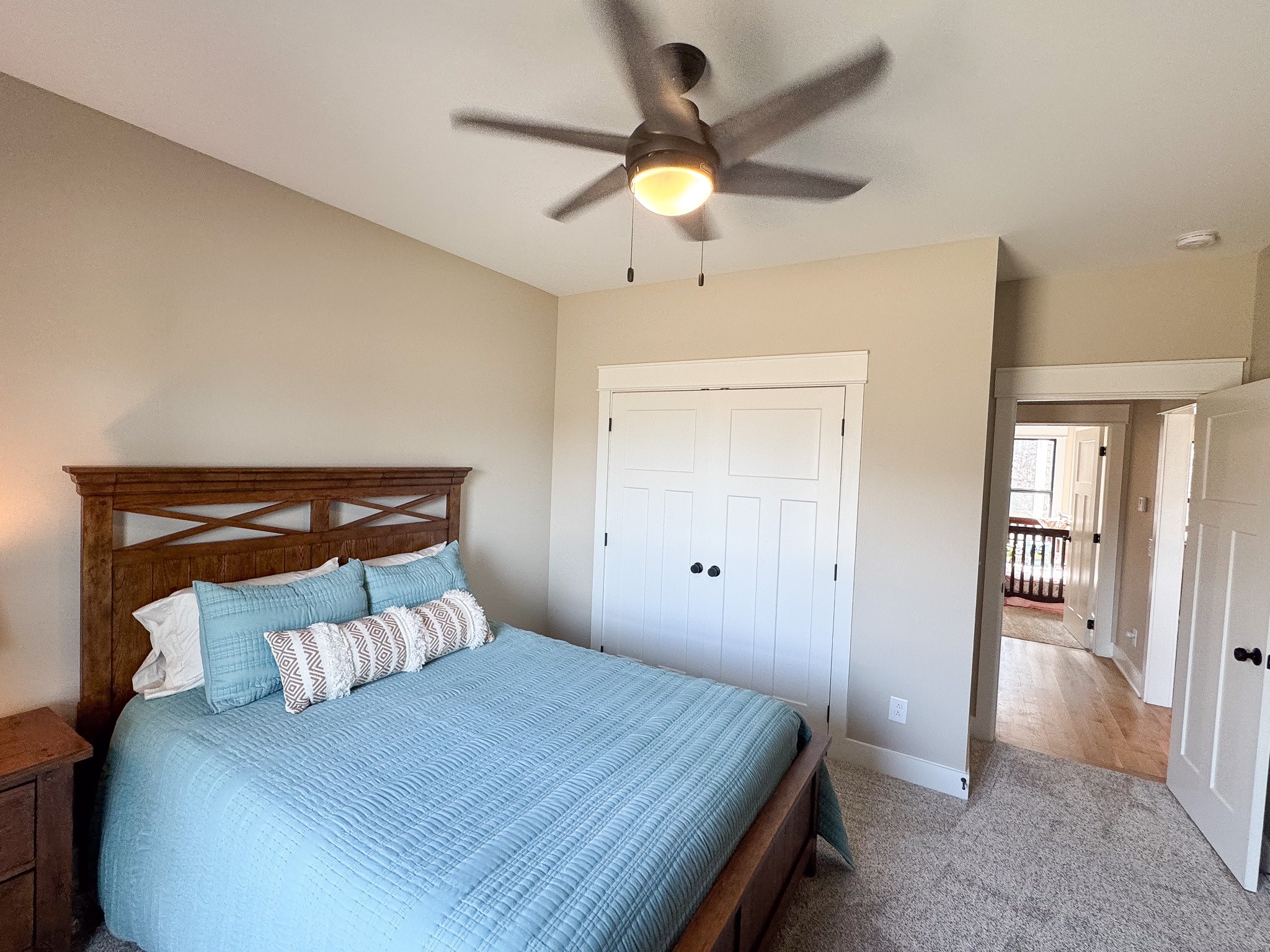 138 Belcher Hollow Road Cottontown, TN 37048 - Photo 53 of 60 a bedroom with a bed and a chandelier