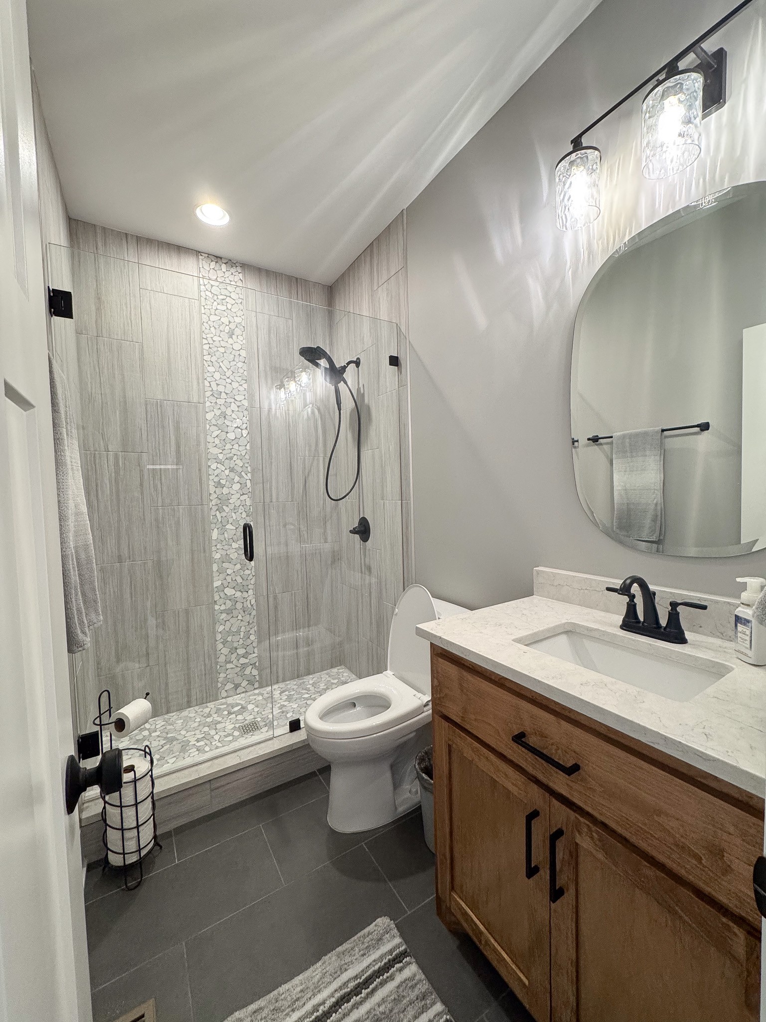 138 Belcher Hollow Road Cottontown, TN 37048 - Photo 59 of 60 a bathroom with a double vanity sink toilet and shower