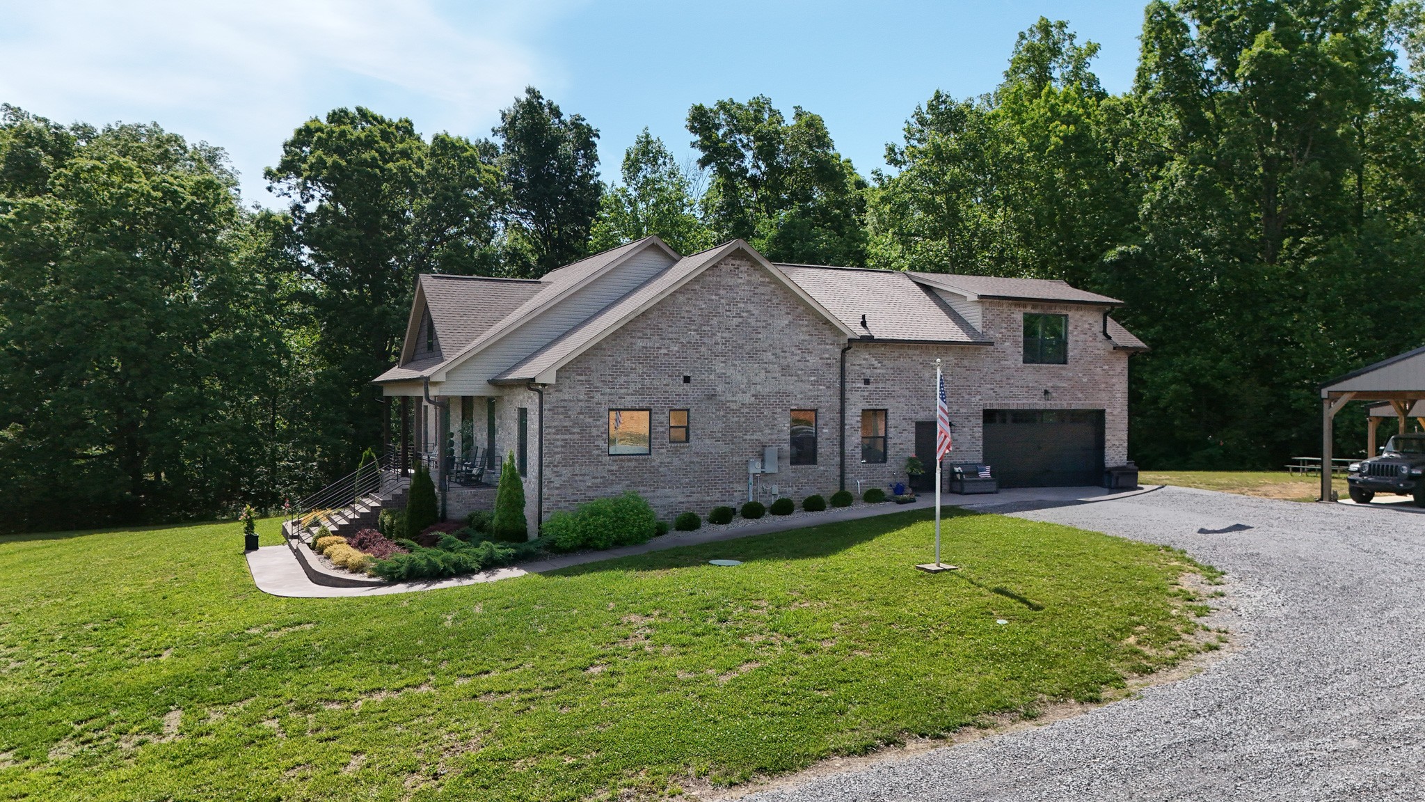 138 Belcher Hollow Road Cottontown, TN 37048 - Photo 6 of 60 a aerial view of a house with a yard table and chairs