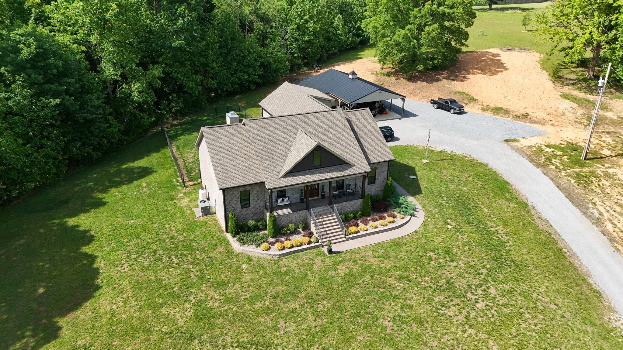 138 Belcher Hollow Road Cottontown, TN 37048 - Photo 7 of 60 an aerial view of a house with a garden and swing