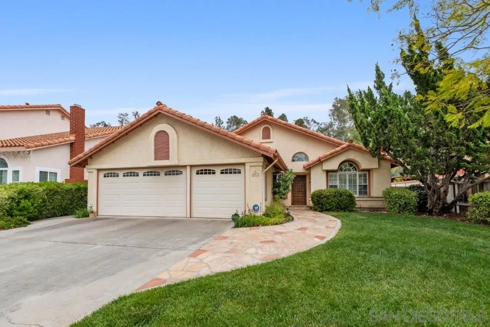 13873 Carriage Road Poway, CA 92064 - Photo 1 of 32 a view of house with a big yard and large trees