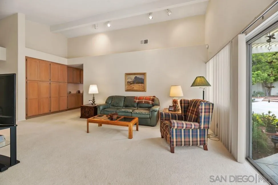 13873 Carriage Road Poway, CA 92064 - Photo 13 of 32 a living room with furniture and a window