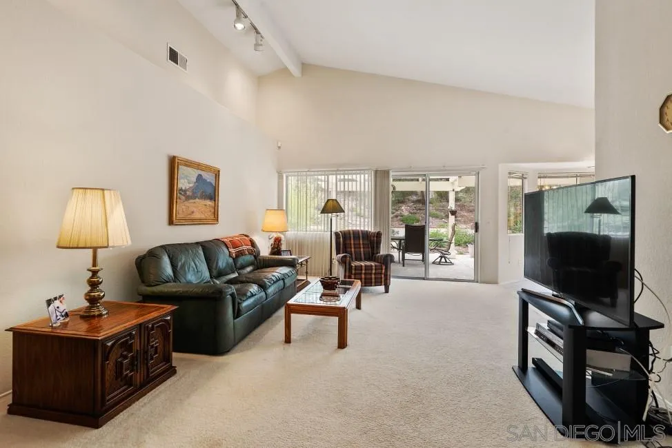 13873 Carriage Road Poway, CA 92064 - Photo 14 of 32 a living room with furniture and a flat screen tv
