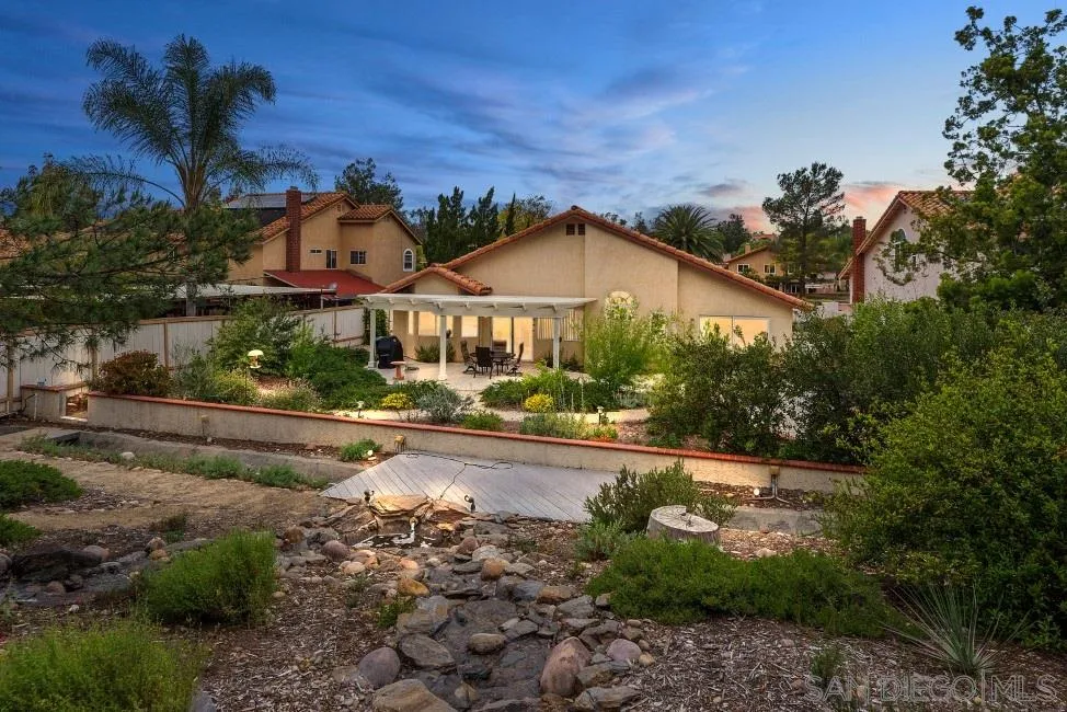 13873 Carriage Road Poway, CA 92064 - Photo 3 of 32 a view of a town with large trees and plants