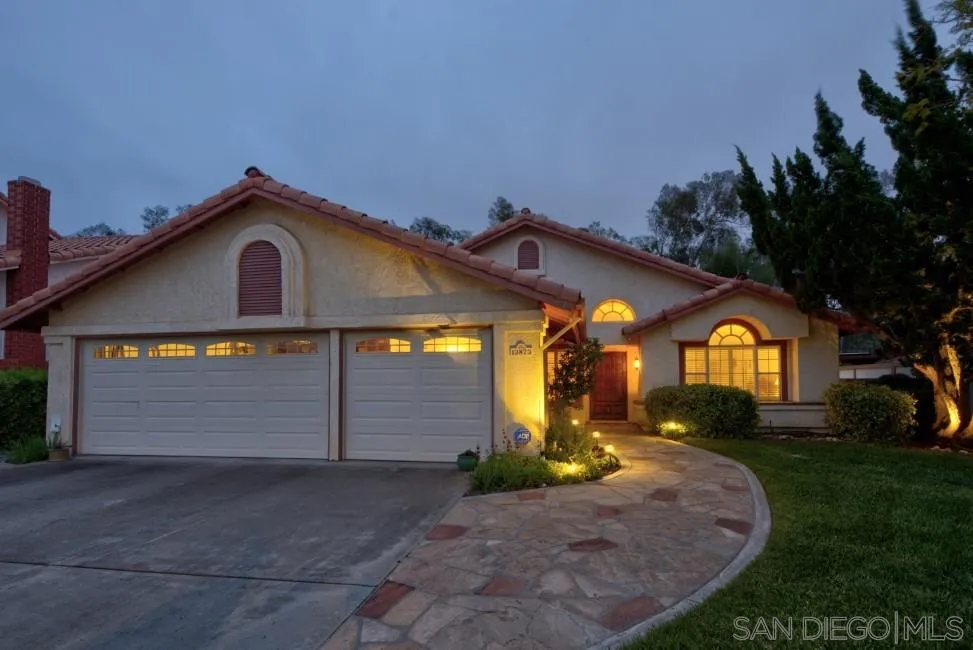 13873 Carriage Road Poway, CA 92064 - Photo 32 of 32 a front view of a house with a yard and garage
