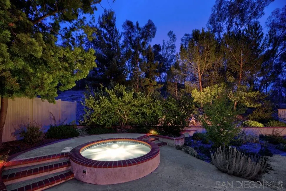 13873 Carriage Road Poway, CA 92064 - Photo 4 of 32 a view of a swimming pool with an outdoor seating