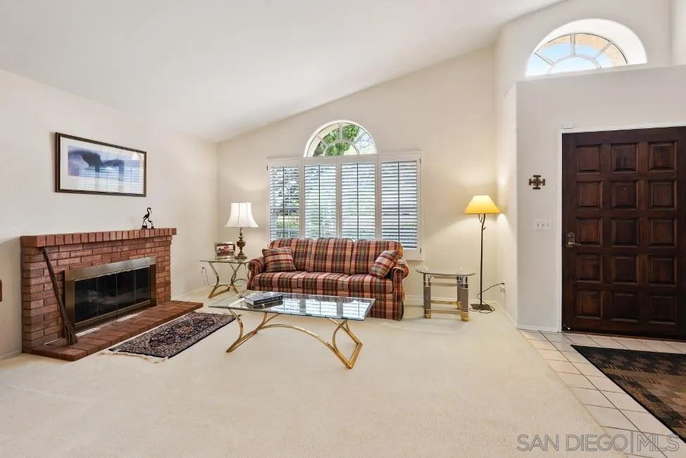 13873 Carriage Road Poway, CA 92064 - Photo 6 of 32 a living room with furniture a fireplace and a window