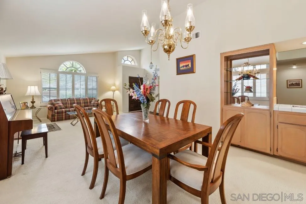 13873 Carriage Road Poway, CA 92064 - Photo 9 of 32 a view of a dining room with furniture