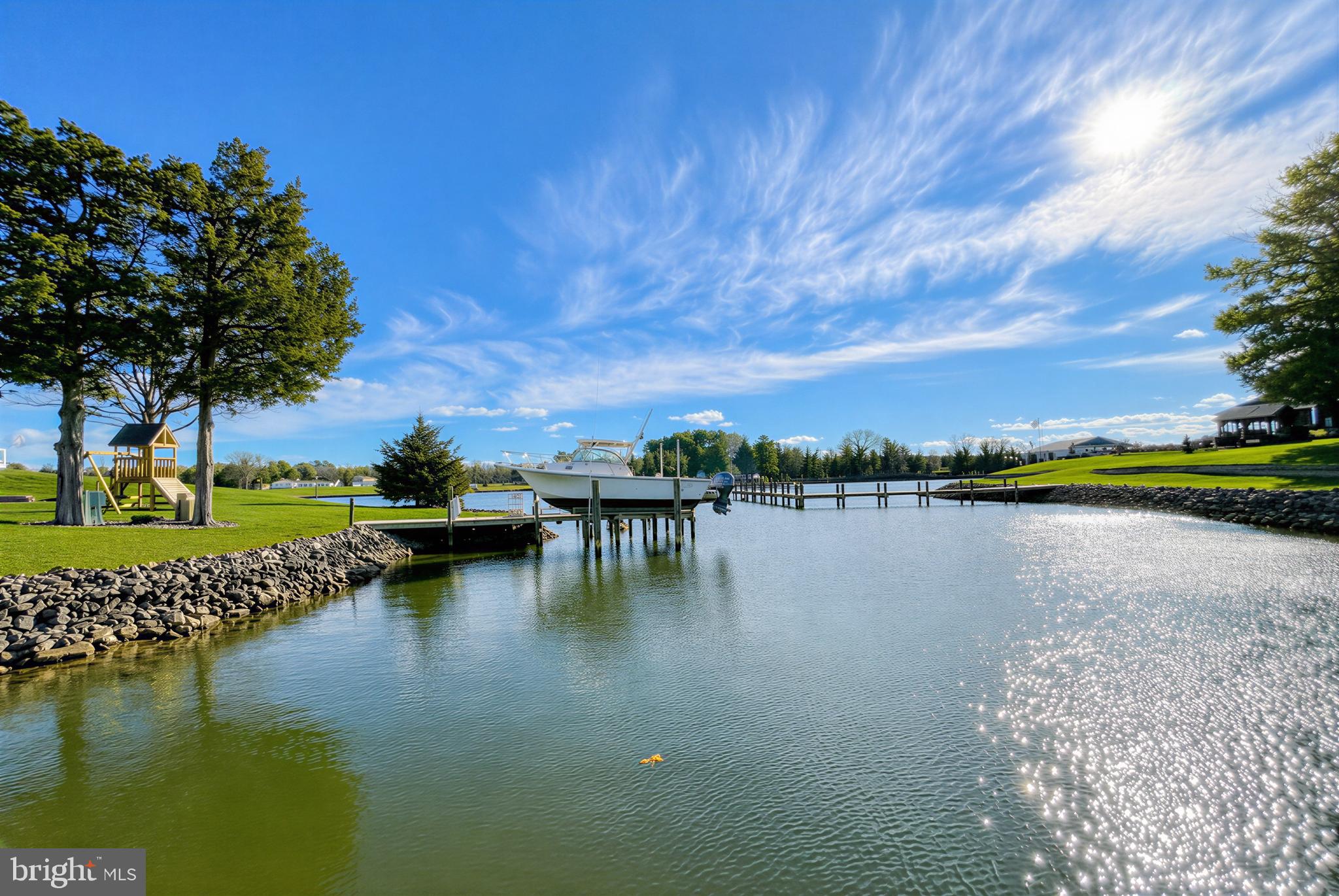 610 Rolling Hills Road Solomons, MD 20629 - Photo 12 of 43 a view of a lake with houses in back
