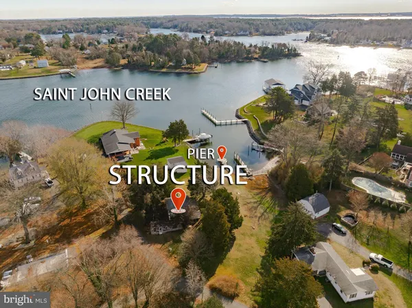 an aerial view of a house with a lake view