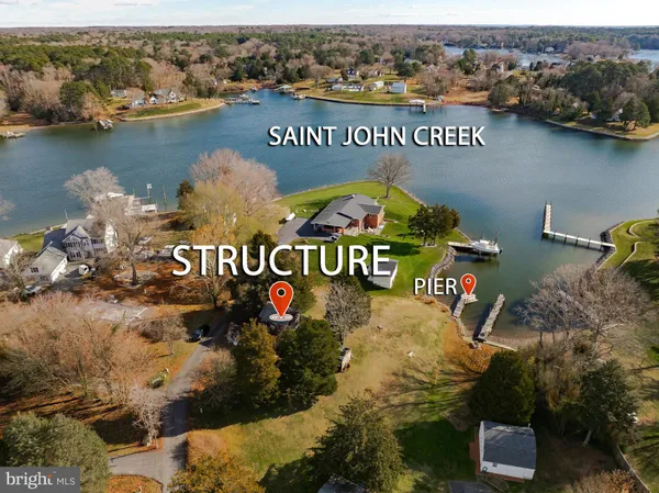 an aerial view of a house with a lake view