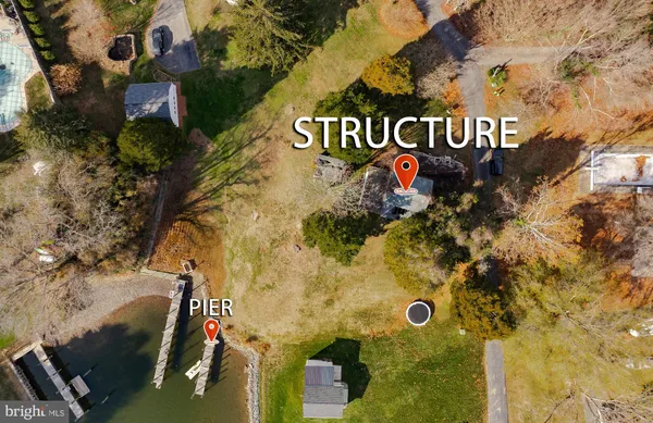 an aerial view of residential house and car parked